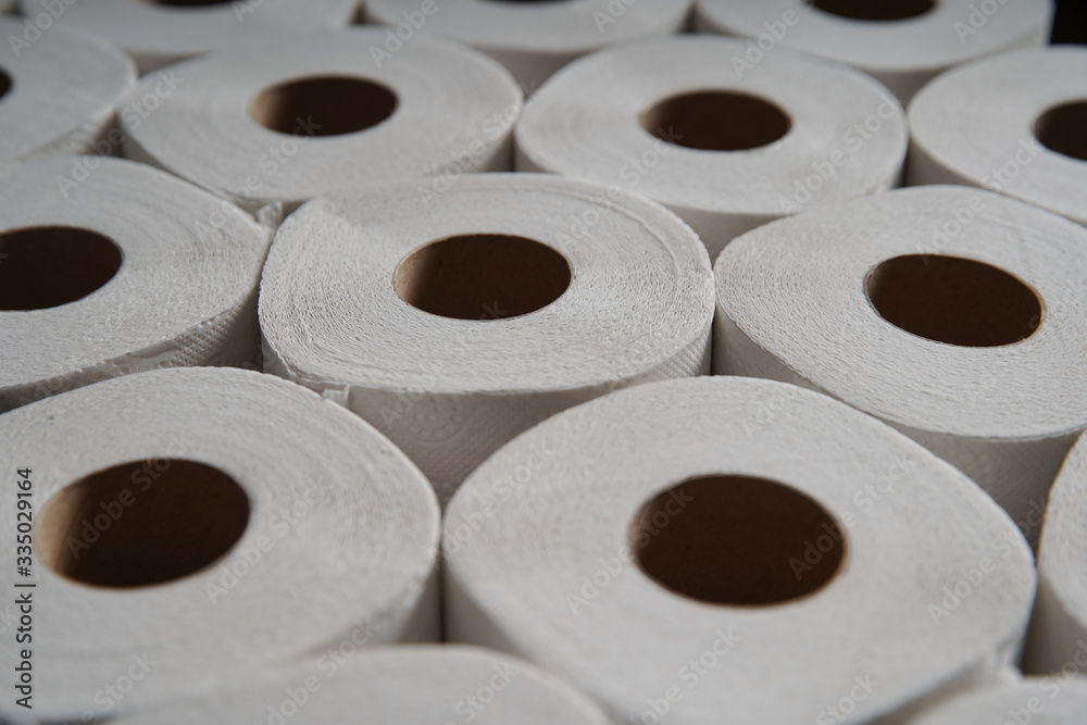 Toilet paper roll accumulation on production line. background Toilet paper roll accumulation on production line. background