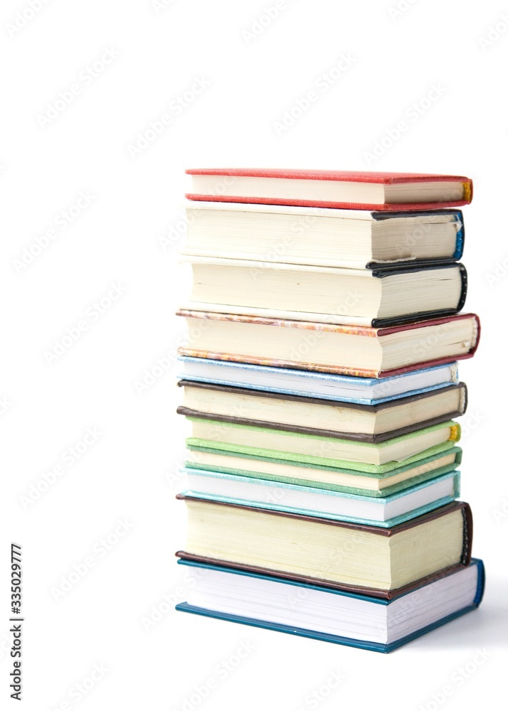 Fototapeta premium Stack of colored books on white background. Love of reading