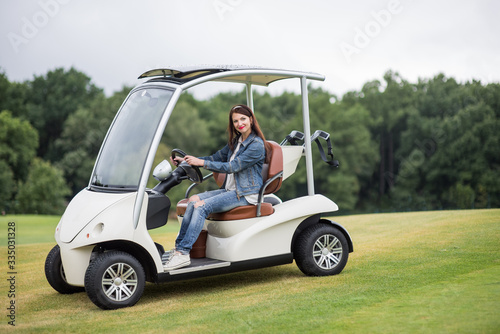 women in the golf car