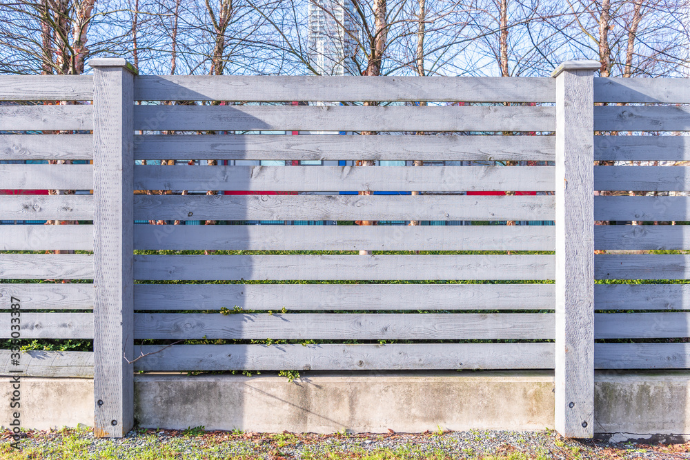 Fence built from wood. Outdoor landscape. Security and privacy concept. Vancouver. Canada. Fence built from wood. Outdoor landscape. Security and privacy concept. Vancouver. Canada.