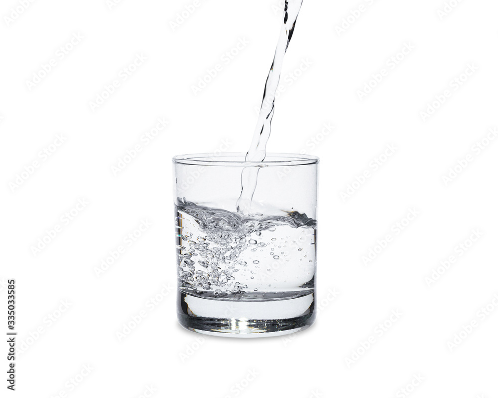 Pour water in glass isolated on white background with clipping path. Pour water in glass isolated on white background with clipping path.