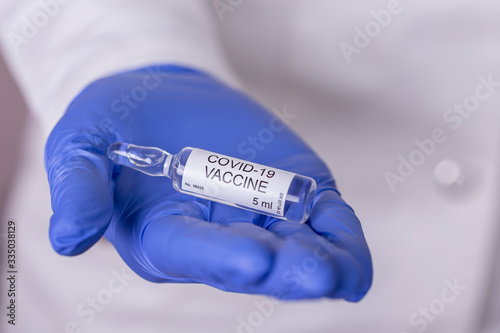 Immunologist holding novel coronavirus vaccine