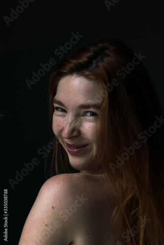 Ginger hair young white model with black background