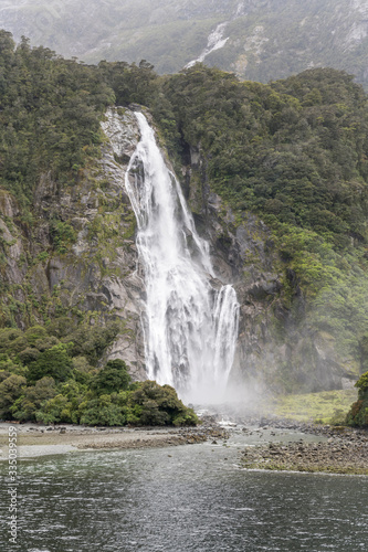 Bowen fall waterfall at fjord shore   Milford Sound  New Zealand