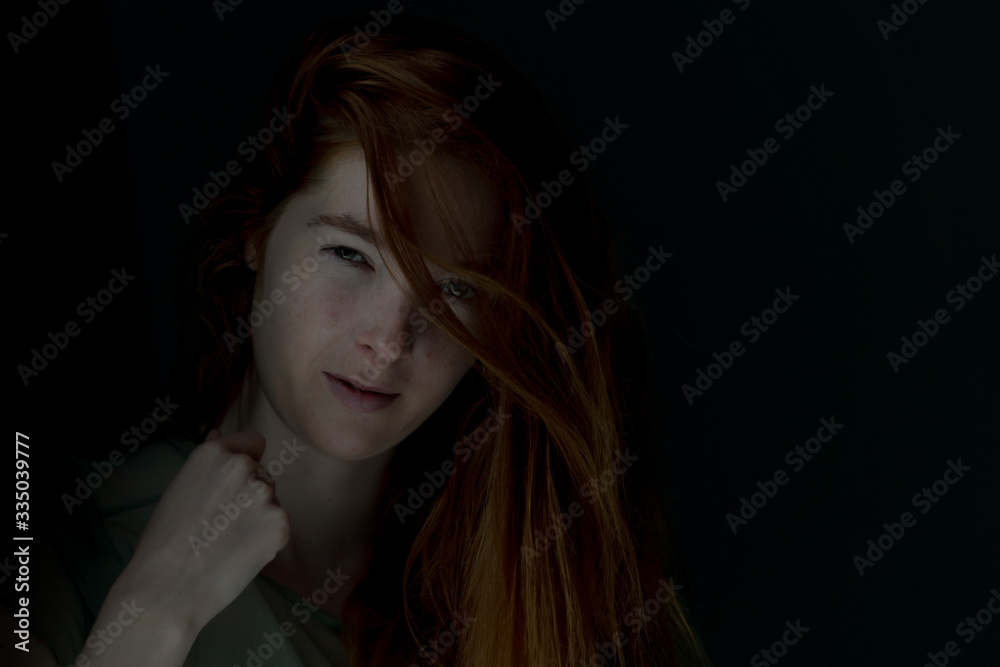 Ginger hair young white model with black background Ginger hair young white model with black background