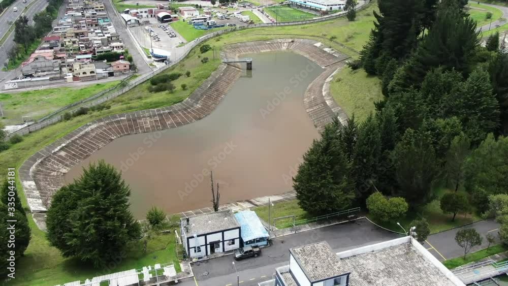 Aerial top view recirculation solid contact clarifier sedimentation tank Water treatment plant, Aerial view of reservoir and water treatment facility on a city Aerial top view recirculation solid contact clarifier sedimentation tank Water treatment plant, Aerial view of reservoir and water treatment facility on a city