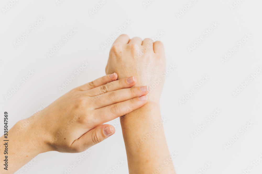 Hands applying moisturizing cream and massaging skin after washing hands. Treatment for dry skin. Luxury skin care. Hand cream. Avoiding dry skin Hands applying moisturizing cream and massaging skin after washing hands. Treatment for dry skin. Luxury skin care. Hand cream. Avoiding dry skin