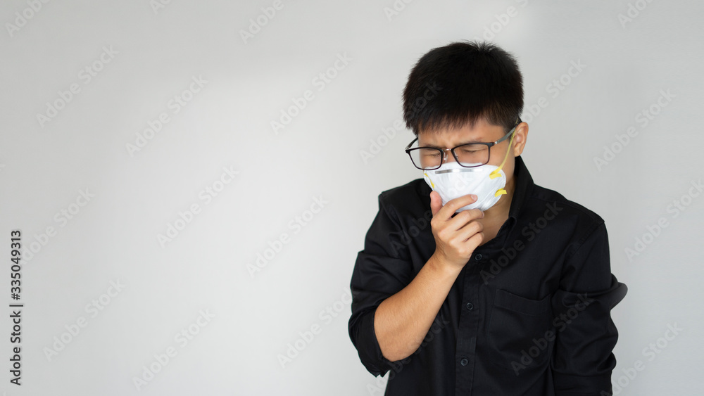 The man wearing face hygienic mask, N95 mask for prevention global covid-19 virus pandemic. He chest pain hand protect close mouse from infectious coronavirus china virus, wuhan
The man wearing face hygienic mask, N95 mask for prevention global covid-19 virus pandemic. He chest pain hand protect close mouse from infectious coronavirus china virus, wuhan