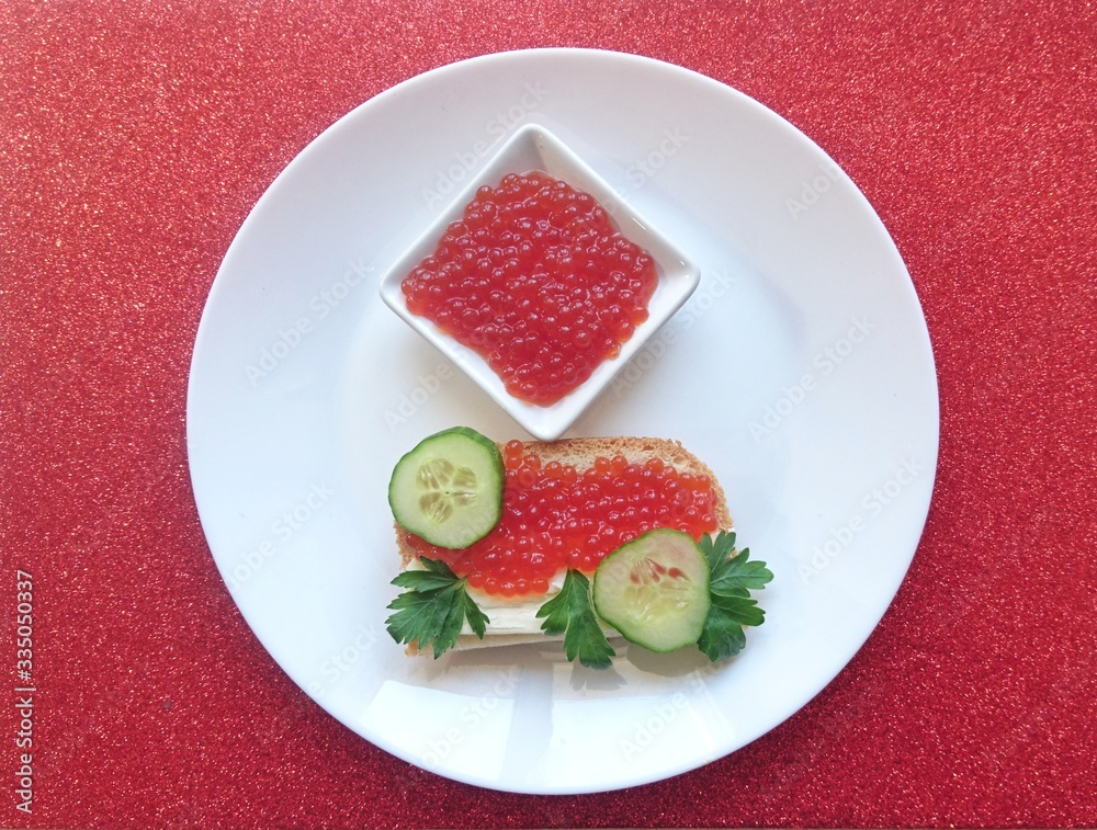 Red caviar of salmon fish, sandwich, cucumber, parsley. Red caviar of salmon fish, sandwich, cucumber, parsley.