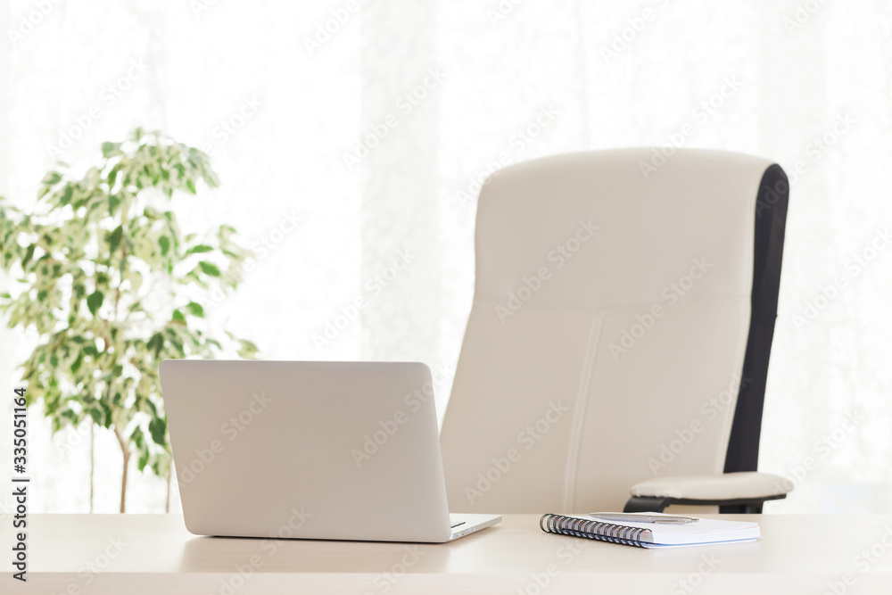 Home office workplace with laptop and supplies Home office workplace with laptop and supplies