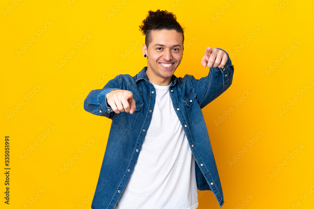 Caucasian man over isolated background pointing front with happy expression Caucasian man over isolated background pointing front with happy expression