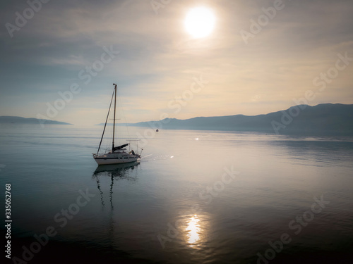 sailboat on the sea at sunset