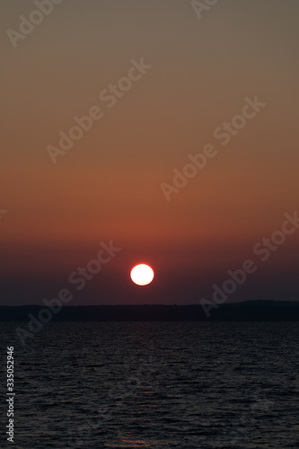 Red sunrise over lake