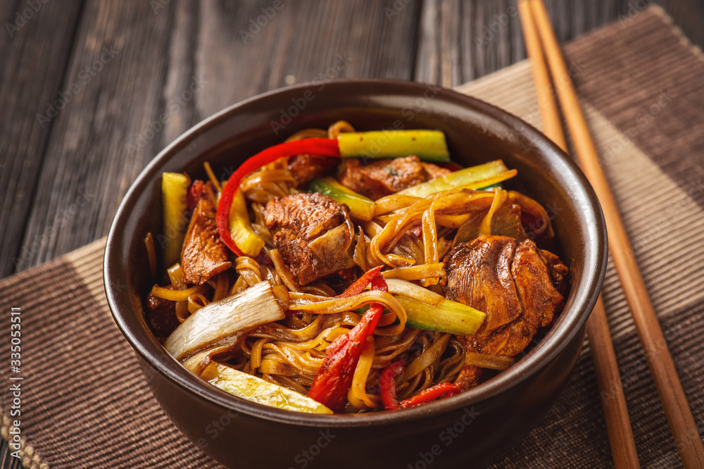 Rice noodles with chicken, soy and vegetables, asian cuisine. Rice noodles with chicken, soy and vegetables, asian cuisine.