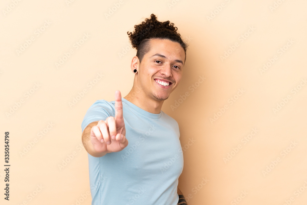 Caucasian man over isolated background showing and lifting a finger Caucasian man over isolated background showing and lifting a finger