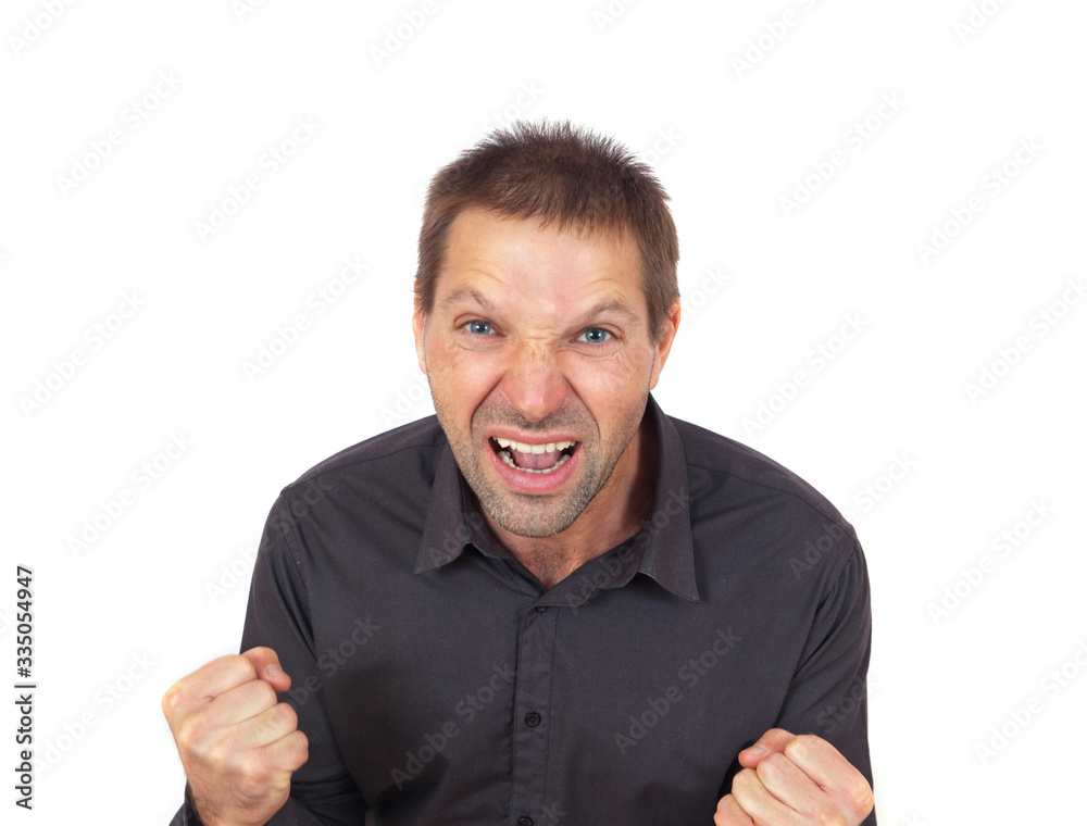 Young man very angry portrait with clenched fists Young man very angry portrait with clenched fists