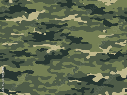 Camouflage green with dark spots seamless pattern. Military.Hunting.Print on fabric on paper.