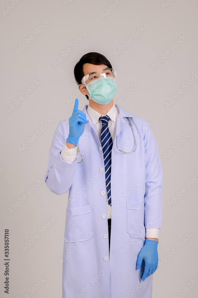 A picture of a male doctor thinking about a cure for the coronavirus outbreak. Outbreak, Coronavirus Outbreak, Covid 19. Doctor Patient in Respirator