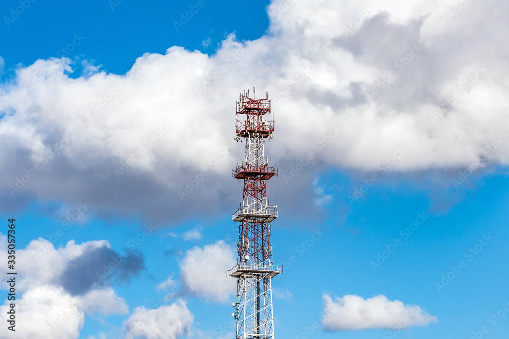 Mobile communications antenna on blue sky background. radio tower and blue sky.