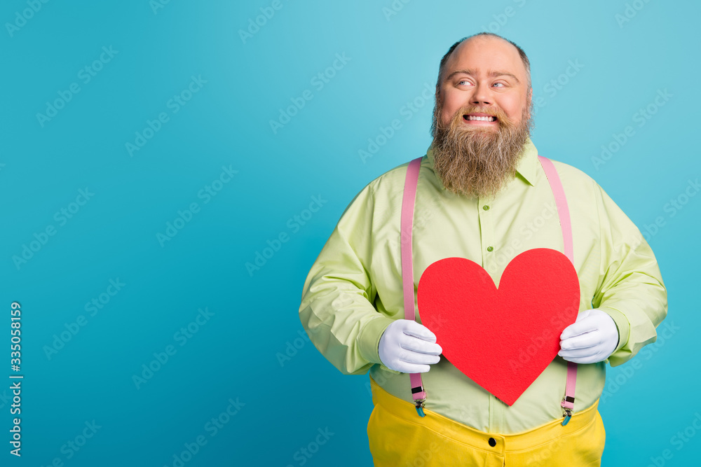 Portrait of his he nice funny glad dreamy cheerful cheery man holding in hands big large heart creating first date idea strategy isolated over bright vivid shine vibrant blue color background Portrait of his he nice funny glad dreamy cheerful cheery man holding in hands big large heart creating first date idea strategy isolated over bright vivid shine vibrant blue color background