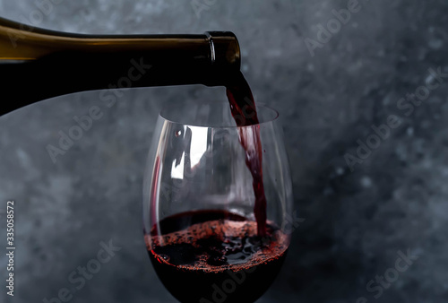 pour wine on a stone background