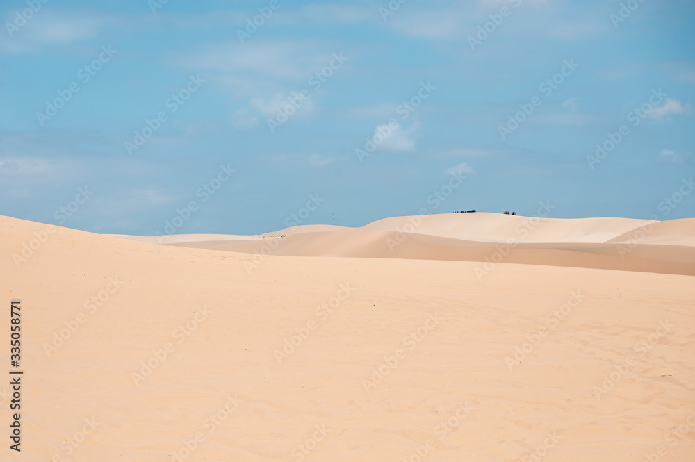 White sand dune with blue sky in desert