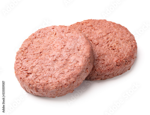two pieces of ground meat substitutes for vegetarian burgers isolated on white background