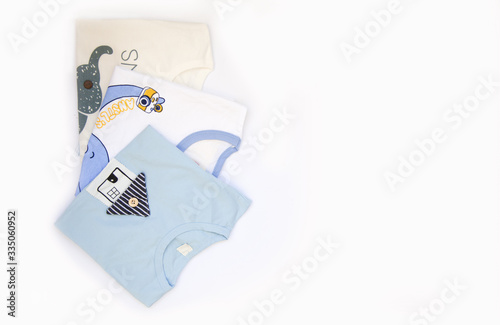 children's clothing shorts, suits, t-shirts, for boys on a white background, top view, place for text.