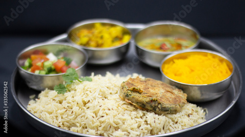 Rice with chicken tikka cutlet and salad salan with sweet