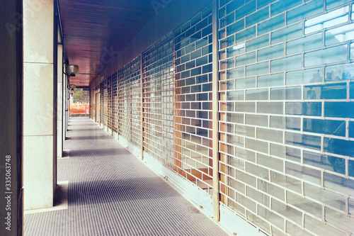 Closed shops. Row of lowered portcullis 