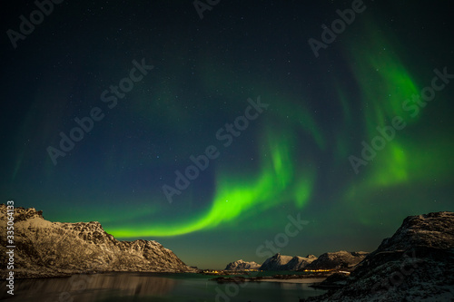 The polar arctic Northern lights hunting aurora borealis sky star in Norway travel photographer mountains. long shutter speed. © Tatiana