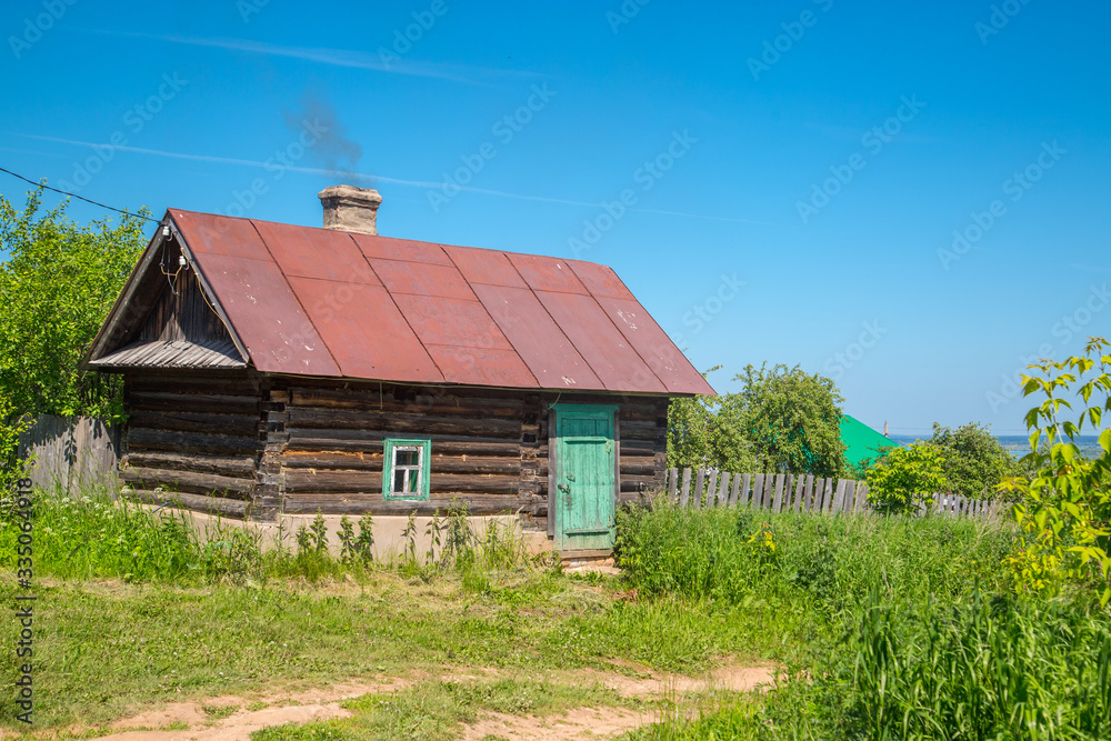 Country Russian bath with smoke coming from the chimney Country Russian bath with smoke coming from the chimney