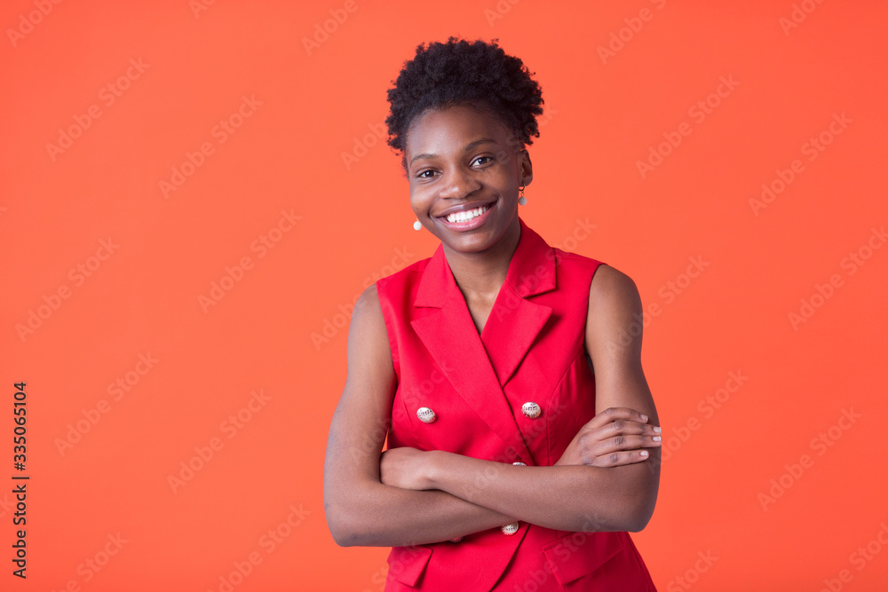 portrait of a beautiful young african woman on red background portrait of a beautiful young african woman on red background