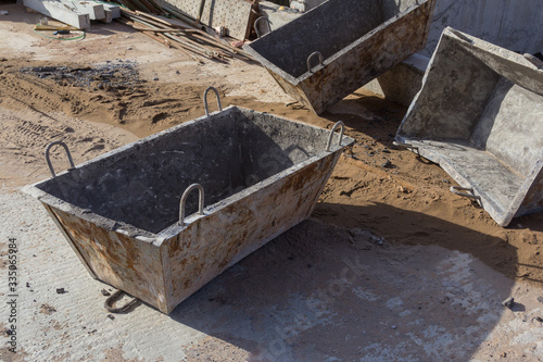 Clean concrete bucket for receiving concrete at a construction site. Concrete bucket for wet concrete