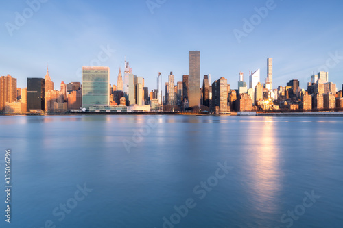 View on Midtown Manhattan From East River during golden hour with long exposure