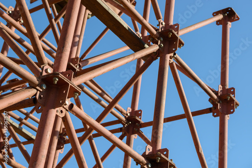 Scaffolding Elements Construction. Metal scaffolding tubes and bars. Construction site details. Bridge support. Industrial background. © Сyrustr