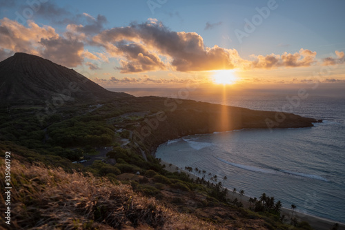 Hanama Bay sunrise - orange - golden hour - over pacific ocean