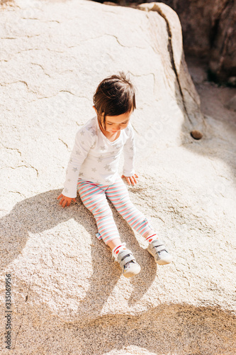 Toddler Girl Exploring Desert Landscape
