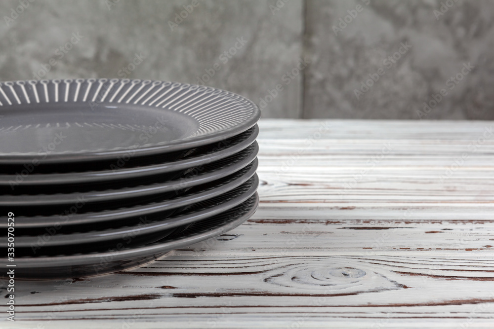 Wooden kitchen counter with new dishware on it. Close up photo Wooden kitchen counter with new dishware on it. Close up photo