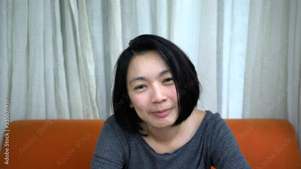 Happy woman talking video call on chat smiling and shy Happy woman talking video call on chat smiling and shy