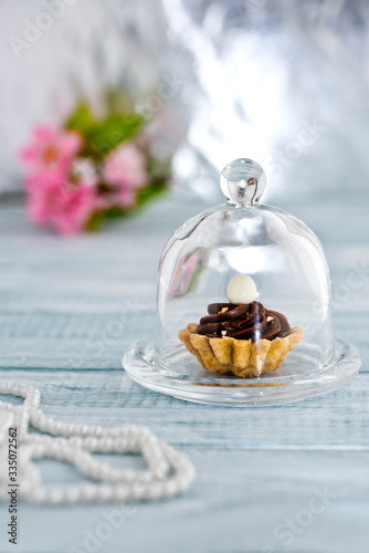 Chocolate caramel muffin with nuts and pearls