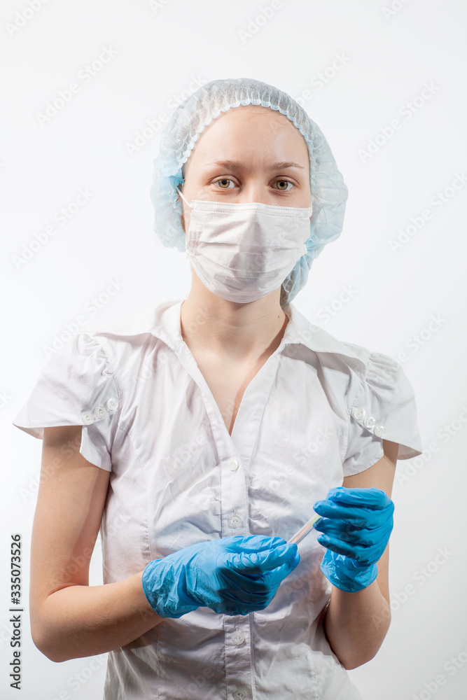 The doctor gloves is wearing a respiratory mask with a positive blood test for a new rapidly spreading coronavirus The doctor gloves is wearing a respiratory mask with a positive blood test for a new rapidly spreading coronavirus