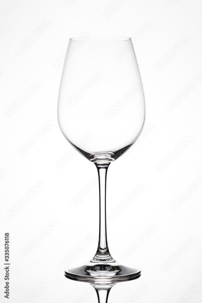Silhouette of an empty wine glass against white background with reflection in Zurich, Europe, Switzerland.