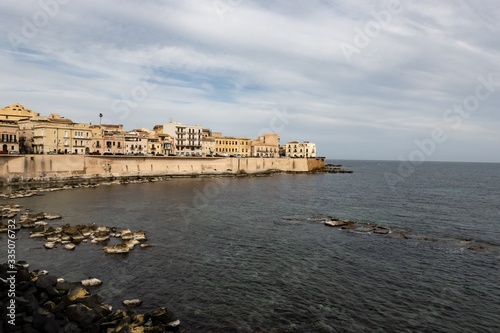 Cityscape of the Siracusa city in Sicily, Italy with a fortification on the Lungomare Ortigia street