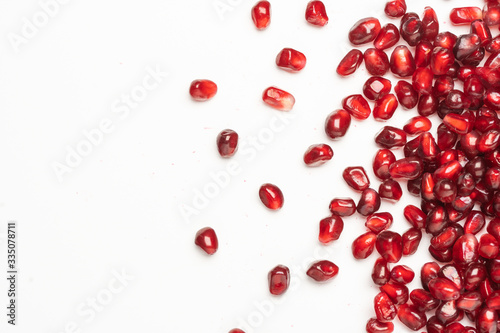 pomegranate seeds on a white background photo