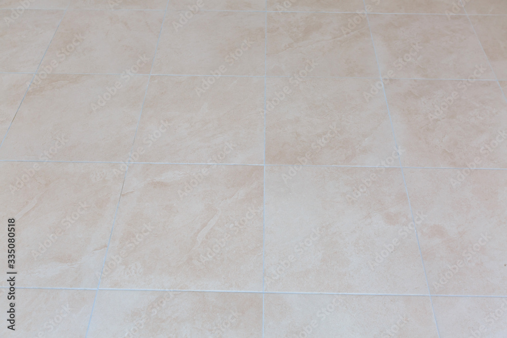 Naklejka premium Brown ceramic floor tiles closeup texture