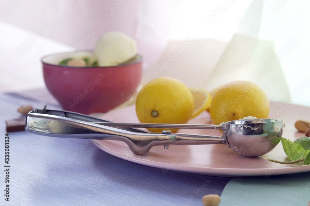 Natural ice cream, lemons on a wooden table, homemade dessert, healthy food Natural ice cream, lemons on a wooden table, homemade dessert, healthy food