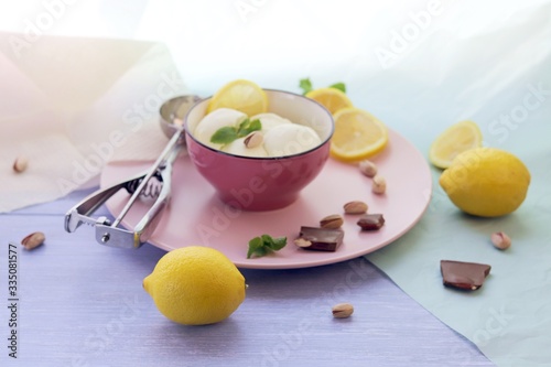 Natural ice cream, lemons on a wooden table, homemade dessert, healthy food