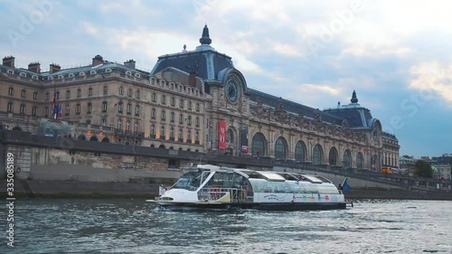 Seine Touring Boat Passes Museau de Orsay in Paris
