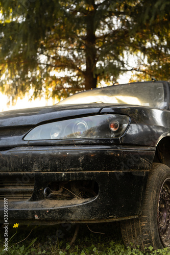 old car abandoned in the forest